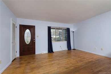 Living room, oak hardwoods throughout home.