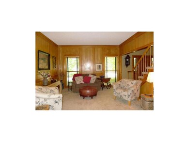 Formal living room with library paneling