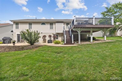 Back of house. Walkout basement, patio, and newer composite deck!