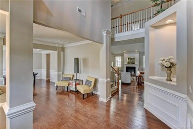 The dramatic 2-story Foyer says 