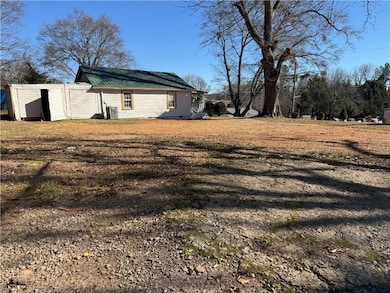 View of yard with a storage shed