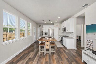 Kitchen featuring stainless steel appliances, bac