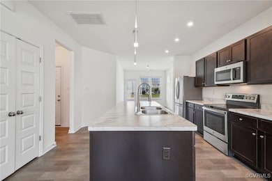 Kitchen featuring appliances with stainless steel