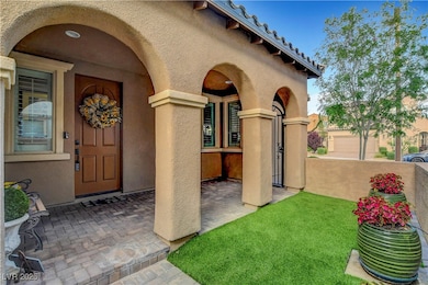 View of exterior entry with stucco siding