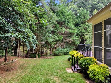 View of yard featuring a sunroom
