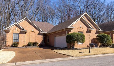 Ranch-style house featuring brick siding, driveway