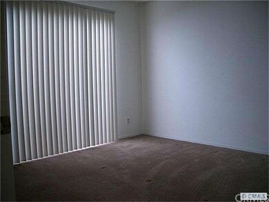 Ample size secondary bedroom has slider leading to