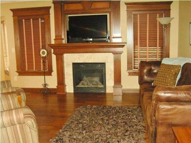 Nice sized Living Area with a FP, dark wood floors