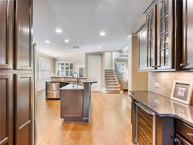 Kitchen with decorative light fixtures, light hard