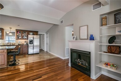 Gas fireplace and built in shelves in dining/livin