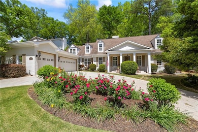 View of front of property with a front lawn, drive
