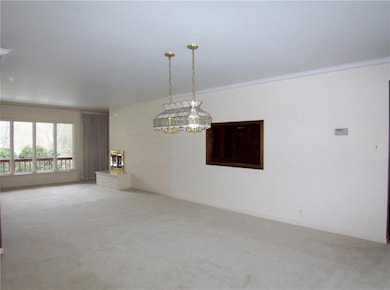 Open floor plan with large windows.