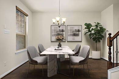 Dining space featuring a chandelier, dark wood-st