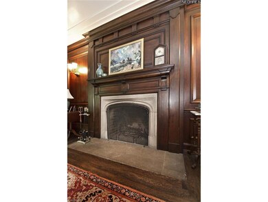 Impressive fireplace with stone floor hearth.