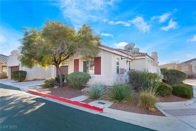 View of front of house featuring a tiled roof and