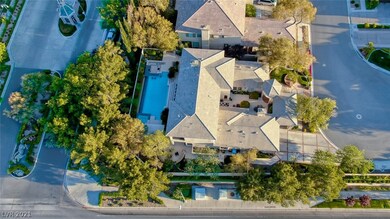 Located in guard gated Queensridge this home sits