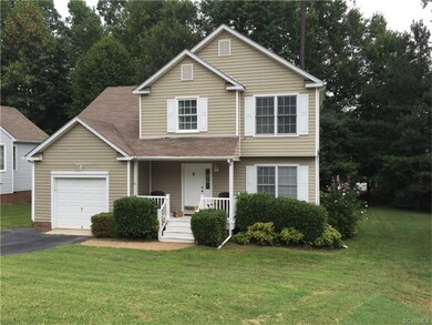 Located on a cul-de-sac lot with a paved driveway,