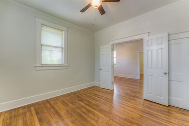 Empty room featuring hardwood / wood-style floorin