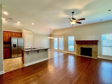 Kitchen with light hardwood / wood-style flooring,