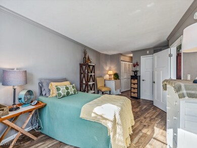 Oversized Bedroom featuring wood-style floors, orn