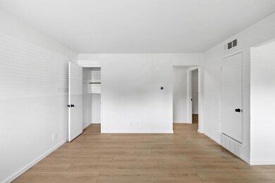 Spare room featuring light wood-style floors and 