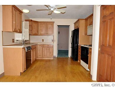 Kitchen. The kitchen is cheerful with light counte