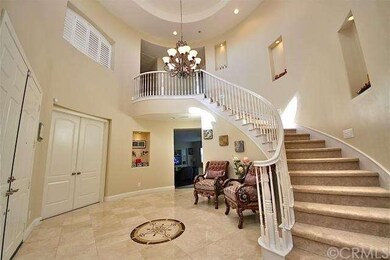 Spacious foyer with rotunda-style ceiling & floor 
