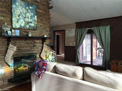 Living room has a sliding door exit to the large s