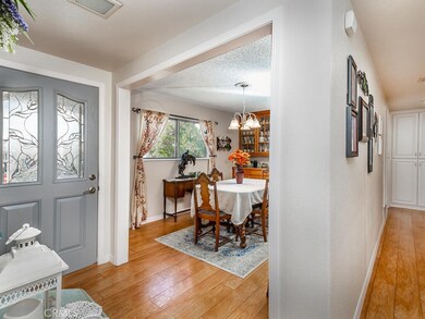VIEW OF DINING RM AND FRONT DOOR
