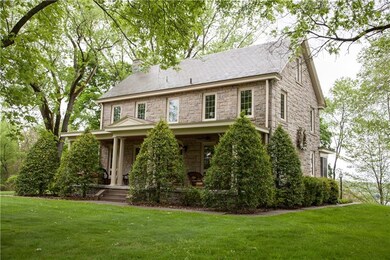 Nestled on a hilltop surrounded by 16 plus acres t