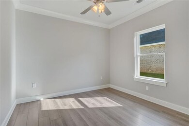SECOND BEDROOM WITH CEILING FAN AND NO CARPET!