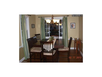 Formal Dining Room with wood floors