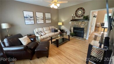 The Charming stone fireplace adds warmth and chara