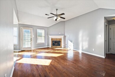 Unfurnished living room with ceiling fan, vaulted 