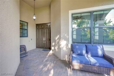 Entrance to property with a patio and stucco sidin