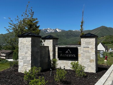 Community sign featuring a mountain view