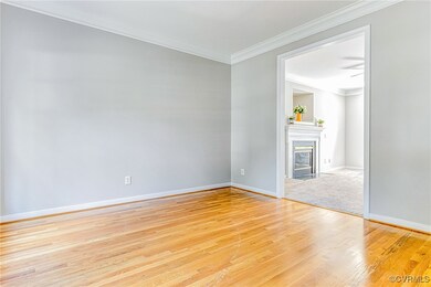 Unfurnished room with ornamental molding and light hardwood / wood-style floors
