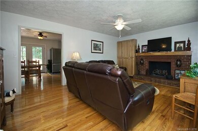 Living room looking into dining room and kitchen.