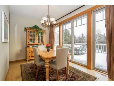 Dining area off kitchen features walk out to large