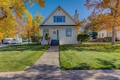 Bungalow-style home with a front yard