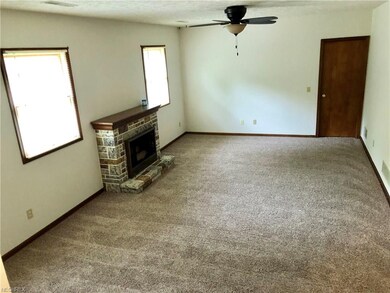 Family room with newer carpeting, adjacent office 