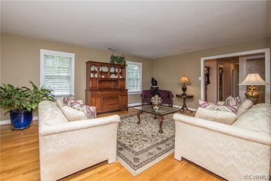 Gracious Living Room with hardwood floors.