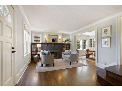 The gracious living room is accented with lovely h
