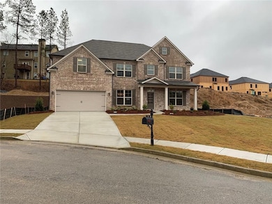 View of front facade featuring concrete driveway, 