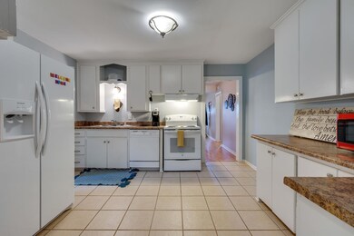 The kitchen is spacious with lots of countertop space as well as storage!