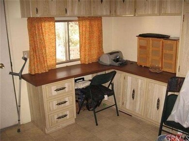 Laundry room with small office area.