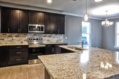 Kitchen Area / View into Dining Area