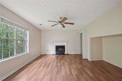 Unfurnished living room with a fireplace with flus