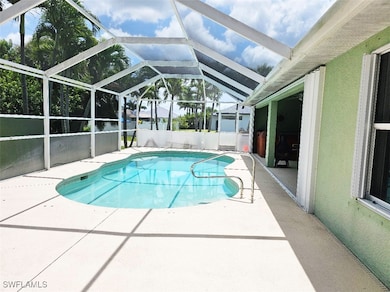 View of pool featuring a patio and a lanai