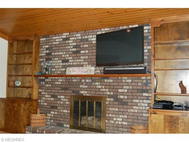 Built in book cases and shelves  on each side of  
